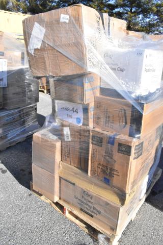 Pallet of boxed scratch and dent items including portion cups, plates, shopping bags, and gloves, wrapped in plastic.