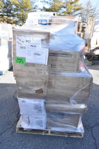 Pallet of 29 scratch and dent items, including gloves, cups, and paper towels, shrink-wrapped and labeled with shipping tags.