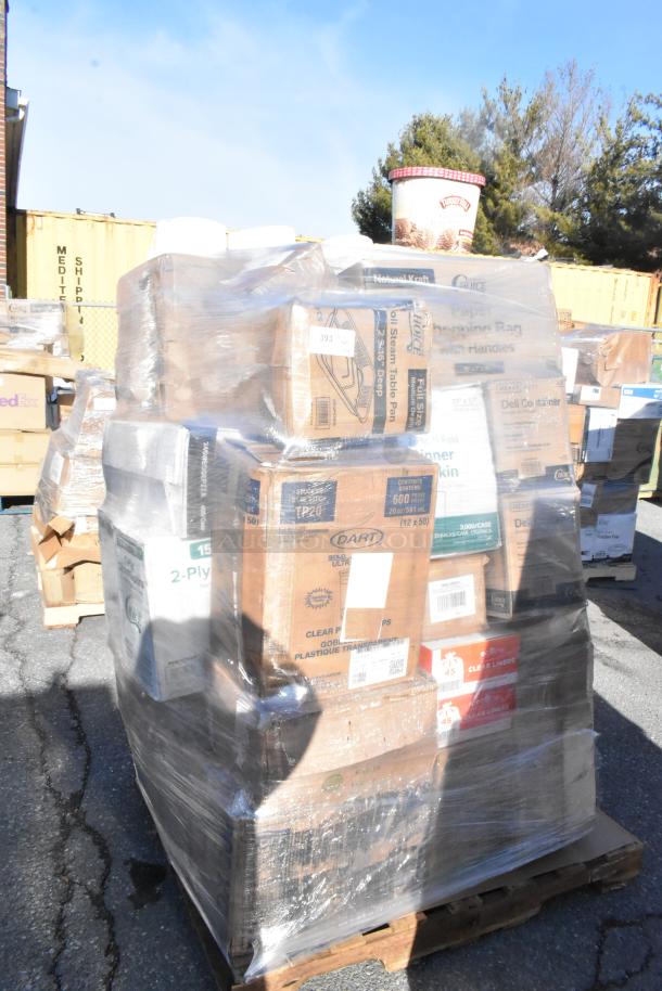 Pallet of various boxed items including bags, plates, and containers, plastic-wrapped for auction. Tags indicate new, scratch, and dent items.