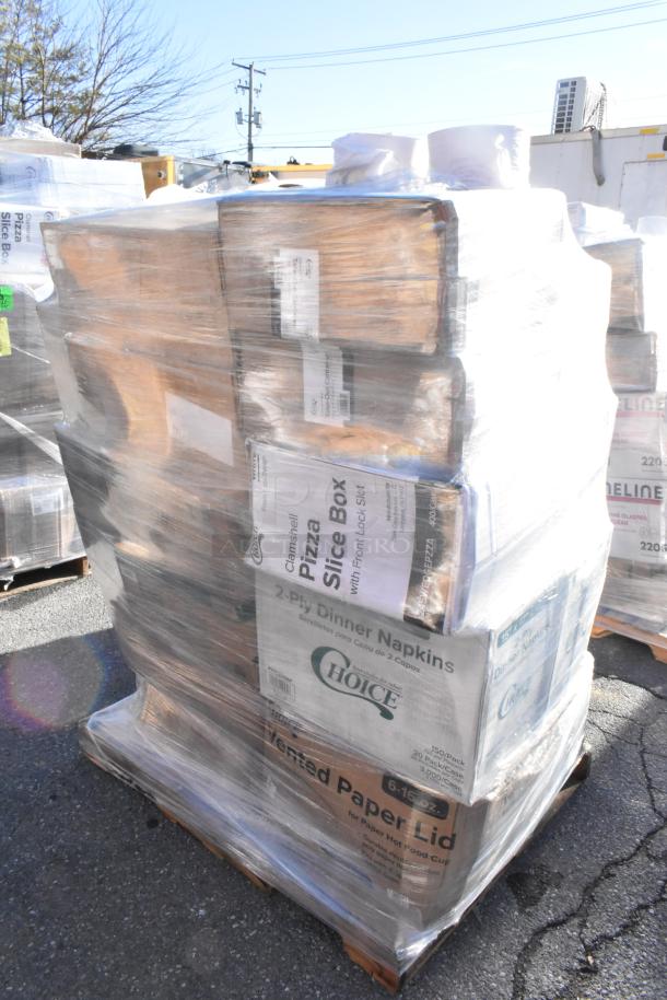 Pallet of assorted scratch and dent items including pizza boxes, napkins, and containers, wrapped in plastic for auction.
