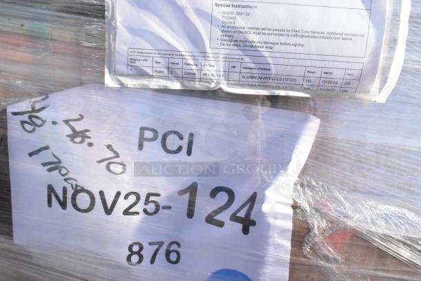 Plastic-wrapped pallet labeled "NOV25-124" containing 42 brand new scratch and dent items like plates, bowl sets, glasses, and cutting boards.