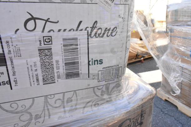 Brand new scratch and dent lot of 46 items including Touchstone napkins and gloves, visible shipping labels, on pallet.