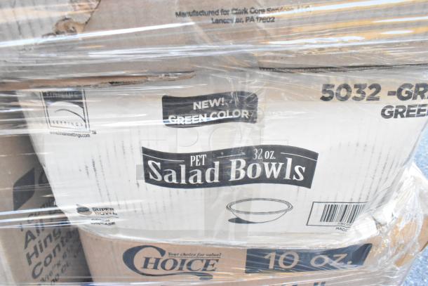 Boxes of 32 oz. PET salad bowls labeled as new green color, packed with other items including lids and cutlery packs.