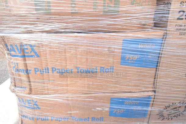 Stacked boxes labeled "Navex Center Pull Paper Towel Roll, 750' Roll" wrapped in plastic. Appears new with clear markings.