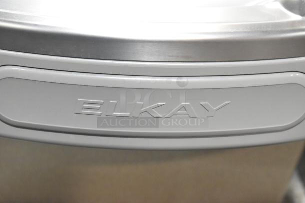 Elkay EZFSB_1H metal wall mount water fountain, 115 volts, 1 phase, features Elkay branding. In good condition.