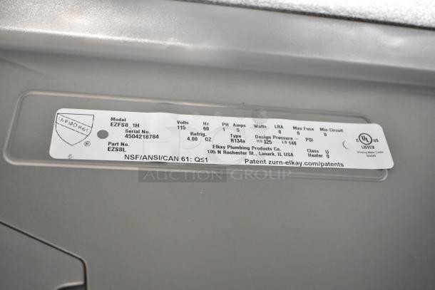 Elkay EZFSB_1H metal wall mount water fountain label showing model, 115 volts, 1 phase, and UL listing.