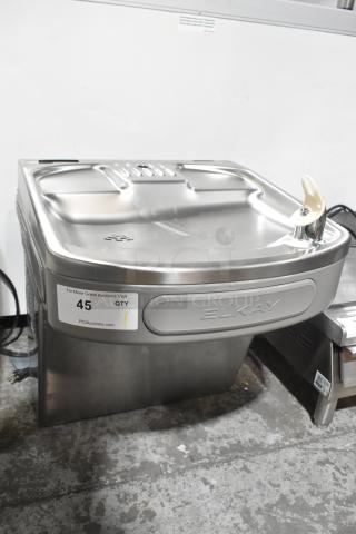 Elkay EZFSB_1H metal wall mount water fountain, 115V, 1 phase. Features include stainless steel finish and integrated nozzle.