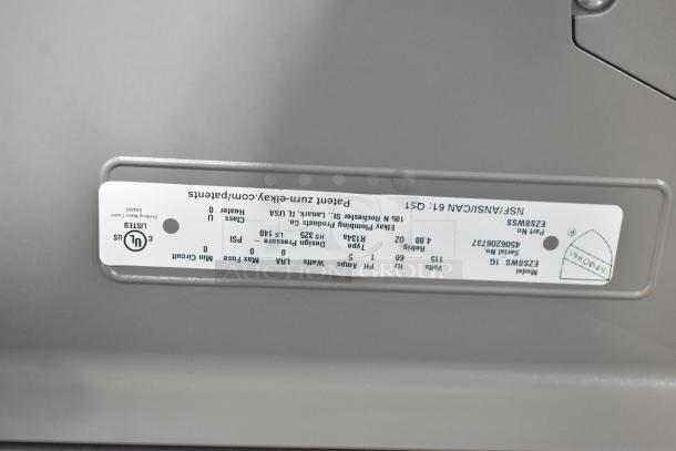 Elkay EZFSB_1H metal wall mount water fountain label, showing model EZS8WSLK, 115 volts, 1 phase, UL certified.