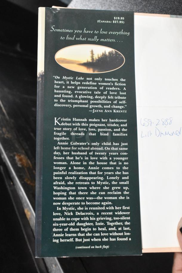 Back cover of "On Mystic Lake" by Kristin Hannah, priced at $19.95 US/$27.95 Canada. Includes a quote by Jayne Ann Krentz and book synopsis.