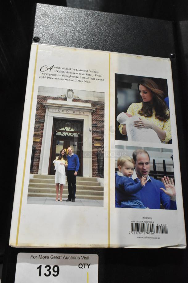 Book featuring the Duke and Duchess of Cambridge, showing images of them with their children. ISBN visible on back cover.