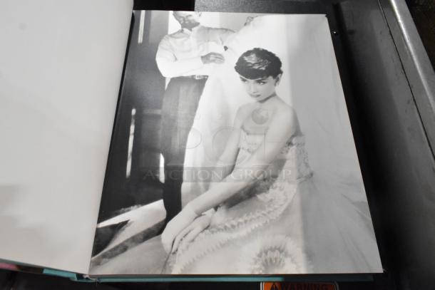 A collection of 13 various books featuring fashion photography, showcasing notable black-and-white images.