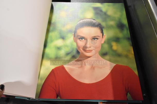 Open book showing a color portrait of a woman in a red top against a green background. Part of a 13-book collection.
