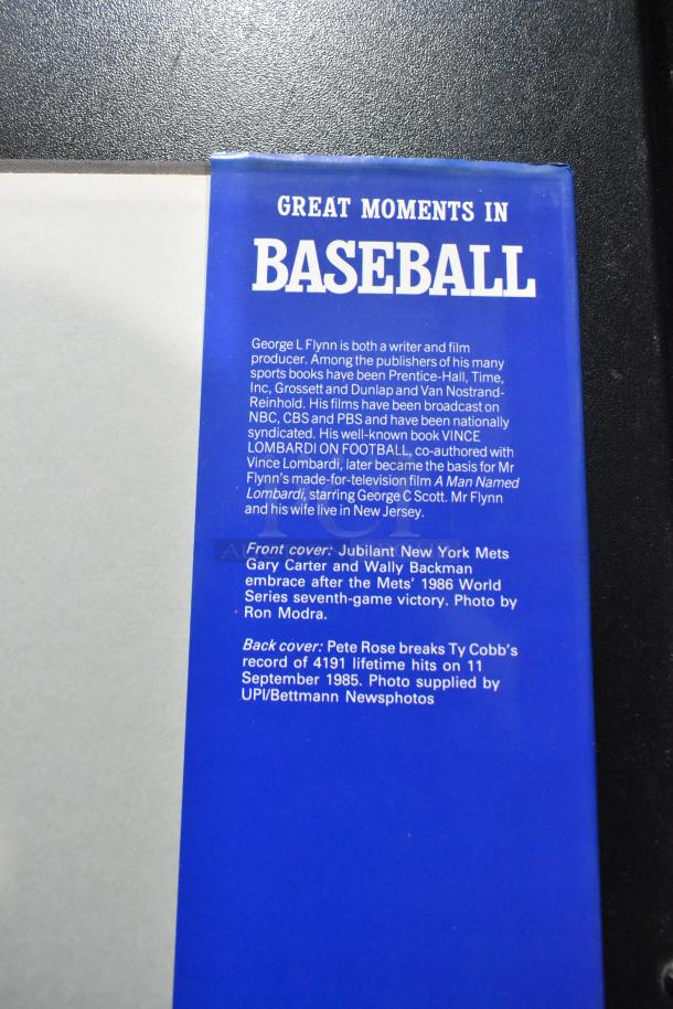 "Great Moments in Baseball" book cover, blue with text detailing author George L. Flynn and significant baseball events.