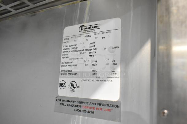 Traulsen ARI132HUT-FHS stainless steel commercial roll-in rack cooler. 115 volts, 1 phase. Label with specs visible.