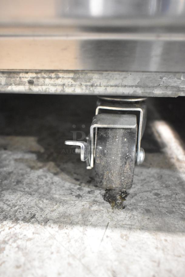 2023 Kutano KUTR1SS cooler on a commercial caster. Stainless steel frame shown with caster details, 115 volts, 1 phase.