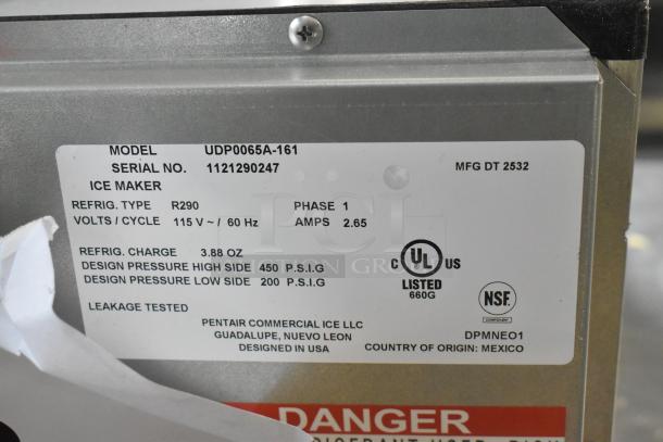 Alt text: Label on 2025 Manitowoc UDP-0065A ice machine showing model, serial number, refrigerant type R290, and electrical specs.