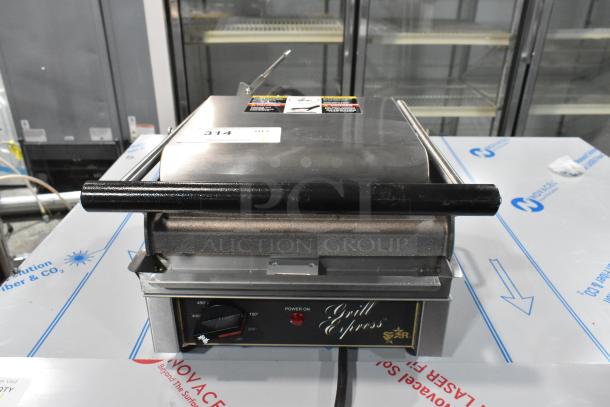 Star GX10IS stainless steel commercial panini press, 120 volts, 1 phase; "Grill Express" label, temperature dial visible.