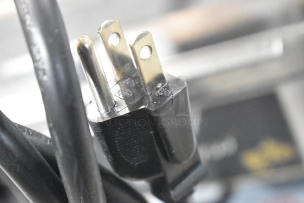 Star GX10IS Stainless Steel Panini Press plug, showing 120V, 1 Phase compatibility. Black power cord, close-up view.