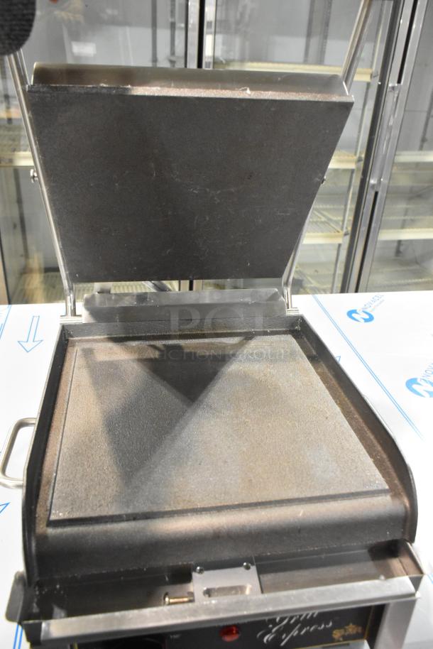 Star GX10IS stainless steel commercial countertop panini press, 120 volts, 1 phase, open lid view, excellent condition.