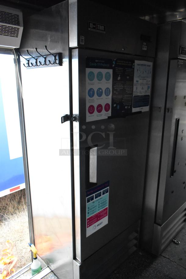 Mobile kitchen interior with U-Star refrigerator, signage, and hooks. Featured in Stuff4less 24' fast food trailer, fully equipped.