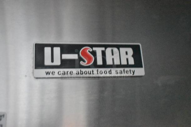 U-Star logo on a metal surface with the text "we care about food safety," indicating quality and food safety commitment.