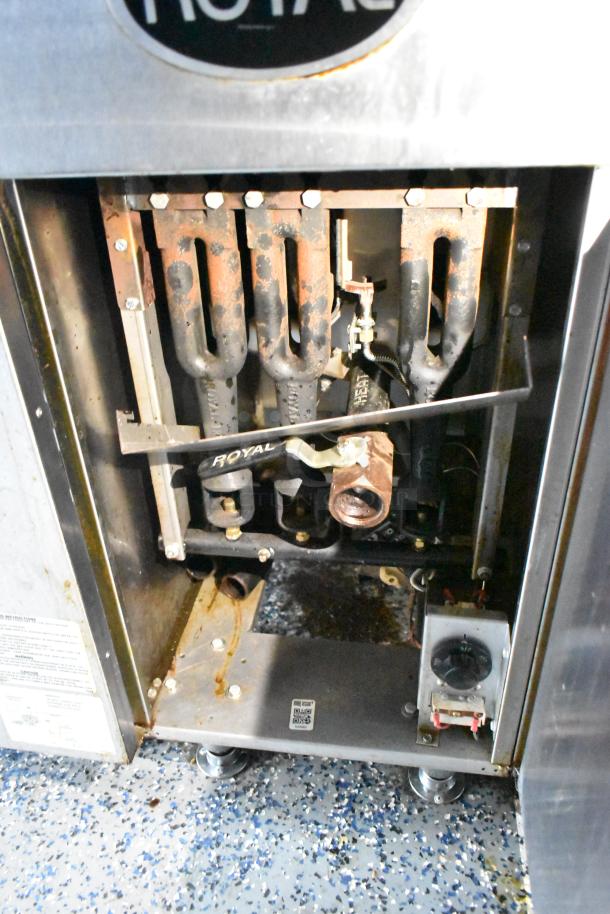 Royal gas fryer interior showing burners and connections, part of a 24' Stuff4less mobile food trailer. Equipment is tested.