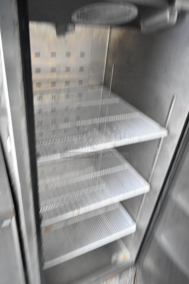 Interior of a Stuff4less 24' fast food trailer with stainless steel shelving. Ideal for commercial food storage.