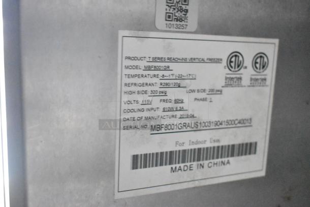 Label on Atosa reach-in vertical freezer, model MBF8001GR, detailing specs including temperature range, refrigerant type, and voltage.