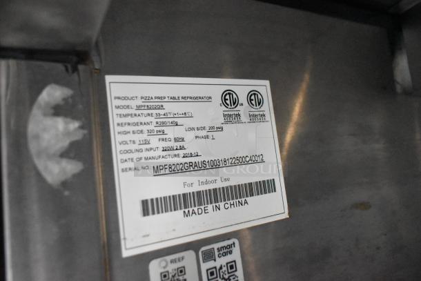 Label on Atosa pizza prep table refrigerator, model MPF8202GR. Temperature: 33-45°F. Refrigerant: R290. Made in China.
