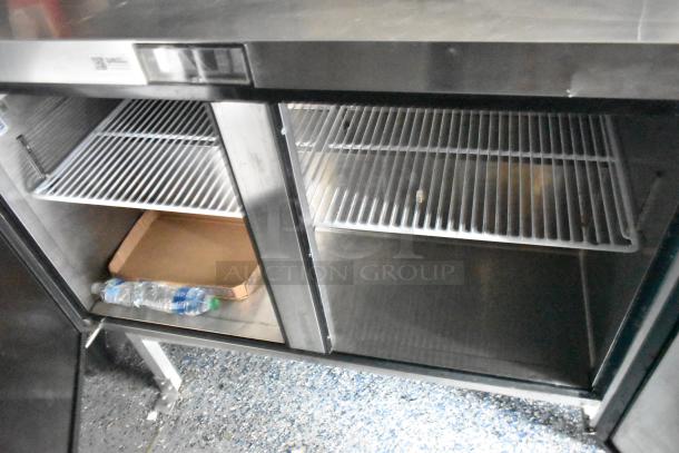 Commercial-grade stainless steel Atosa reach-in refrigerator with dual wire shelves and lower compartment storage.