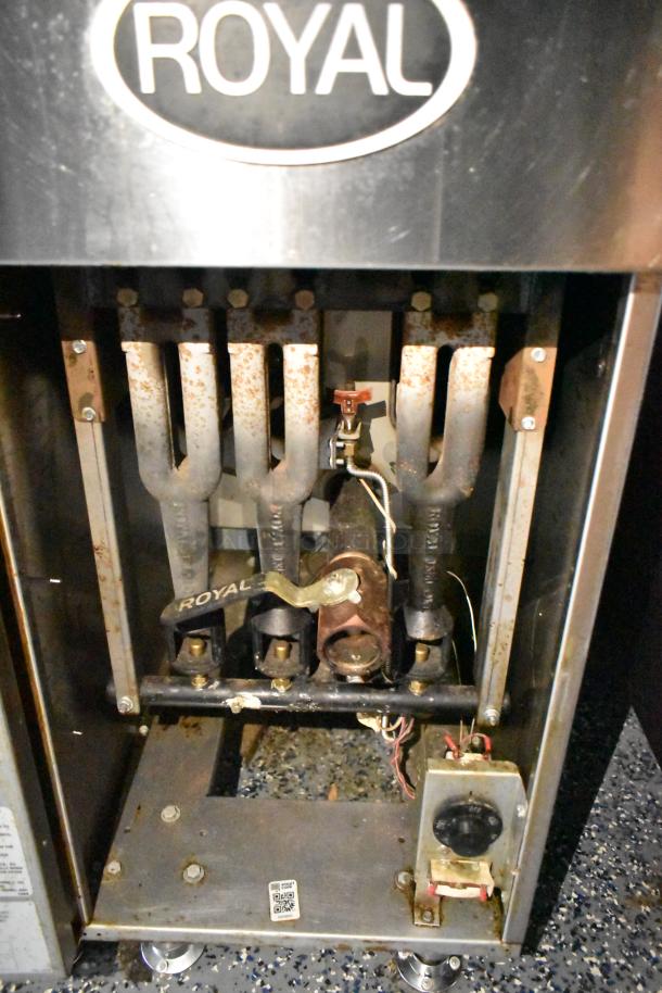 Royal gas fryer interior showing burners in a fast food trailer. Equipment appears tested and functional.