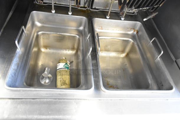 Wells VCS2000 ventless hood system with 2-bay deep fat fryer; commercial casters, signs of use, 208V, 3-phase.