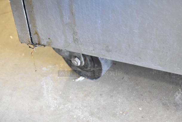 Wells VCS2000 ventless hood cooking system with Wells GSS fryer on casters; shown is a close-up of a caster in used condition.