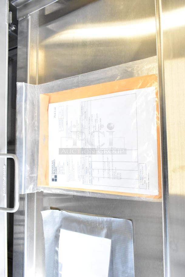 Douglas SD-20-ELEL Pot and Pan Washer, commercial front load, stainless steel interior, visible instructions packet.