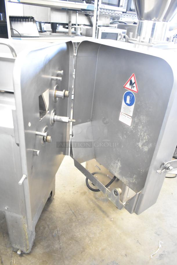 Treif Felix 100-CE industrial food dicer in stainless steel, 800kg/hour capacity. Features voltage and safety labels.