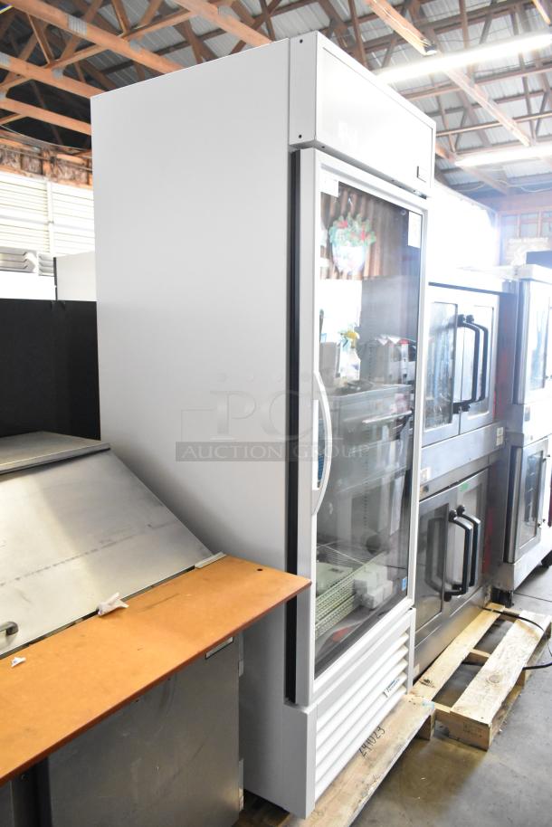 Brand new True TSCI-600R-G-PH commercial cooler; single glass door; poly-coated racks; 115V, 1 phase; scratch and dent.