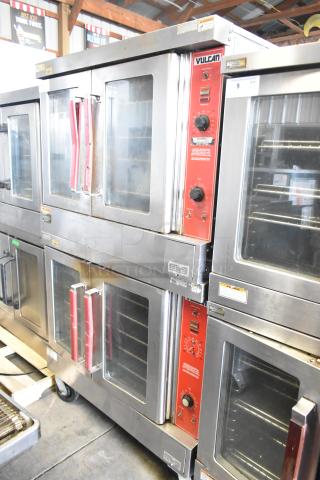 2 Vulcan VC4GD-10 commercial convection ovens with view-through doors and thermostatic controls, silver with red accents.