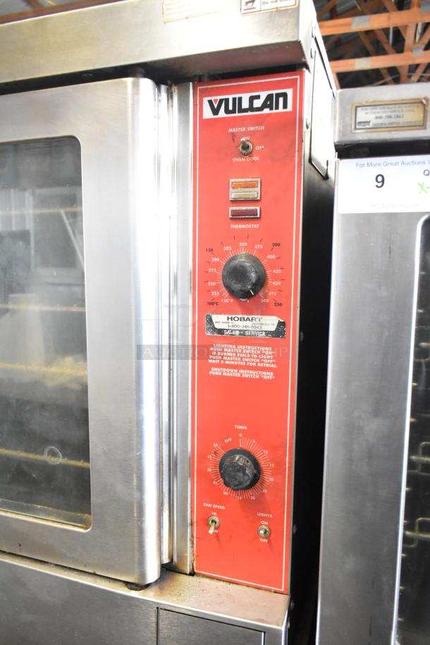 Vulcan VC4GD-10 commercial convection oven with view-through doors and thermostatic controls, showing master switch and thermostat.