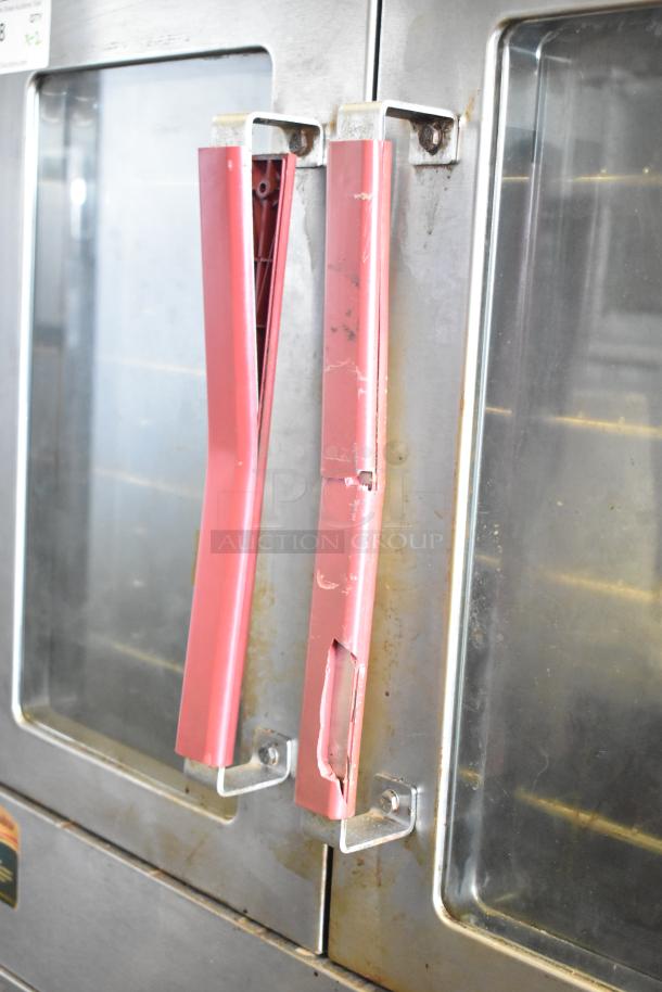 Vulcan VC4GD-10 commercial convection oven, view-through doors, red handles, thermostatic controls, worn condition.