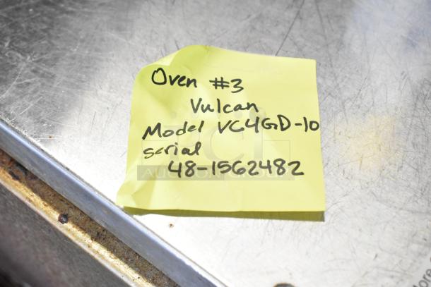 Yellow note with "Oven #3, Vulcan Model VC4GD-10, Serial 48-1562482" on metallic surface.