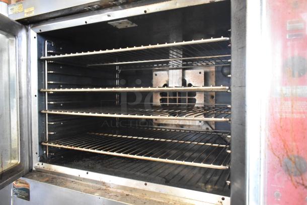 Vulcan VC4GD-10 convection oven with view-through doors, thermostatic controls; interior racks visible, clean condition.