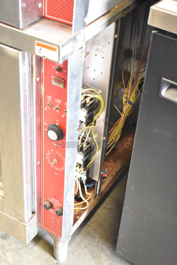 Vulcan commercial convection oven control panel, showing thermostatic controls, wiring, and metal casing.