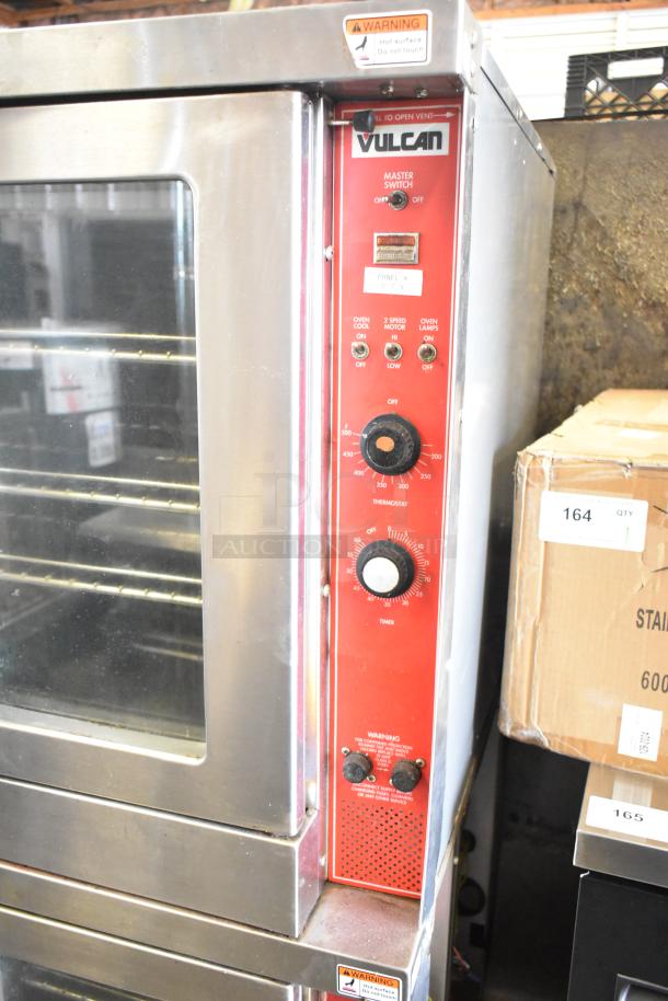 Vulcan commercial full-size convection oven with view-through doors, thermostatic controls. Tag warns of hot surface.