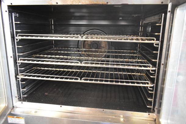 Vulcan commercial full-size convection oven with view-through doors, thermostatic controls, three oven racks, good condition.