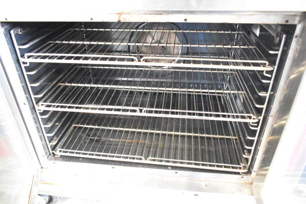 Vulcan commercial convection oven with view-through doors, thermostatic controls, and multiple racks, in used condition.