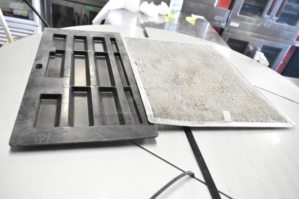 Black and metal components of Manitowoc IYT0420A-161X ice machine and SPA160 dispenser. Items show signs of use.