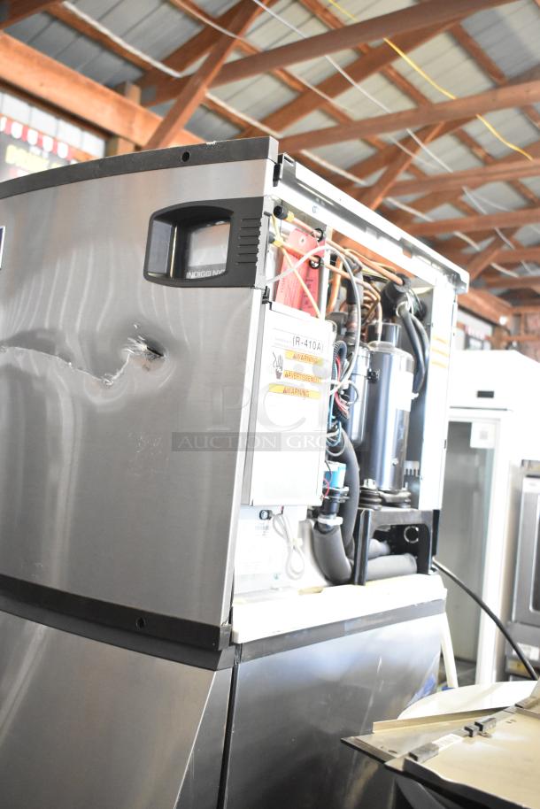 2021 Manitowoc IYT0420A-161X ice machine on SPA160 dispenser, 115V, 1 Phase. Visible dent, exposed wiring.