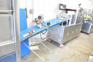 Seny Machinery SY-860 automatic bread maker, stainless steel, 220 volts, features labeling and conveyor belt, excellent condition.