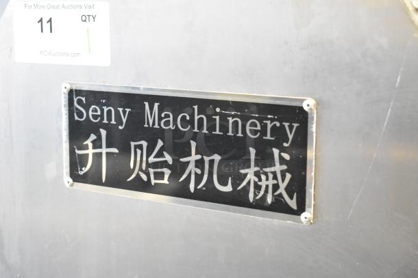 Seny Machinery SY-860 Bread Maker, floor style, automatic, 220 volts. Displays brand plaque in English and Chinese.