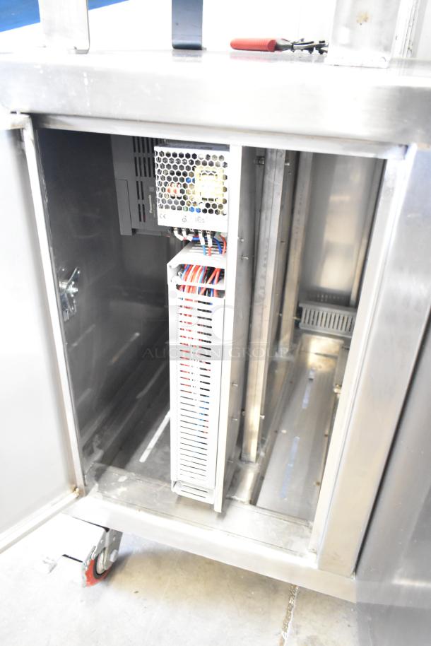 Seny Machinery SY-860 bread making machine interior view, showing wiring and power unit. Durable stainless steel. 220V.
